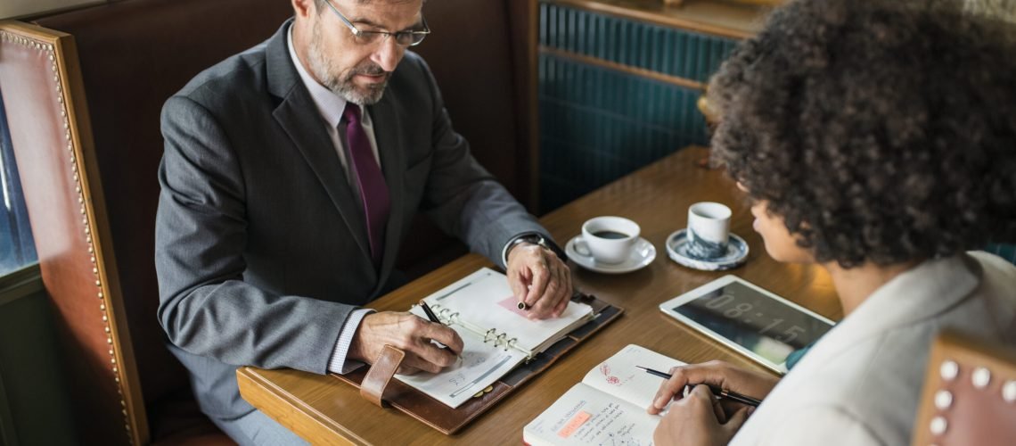 Business people discussing in the cafe